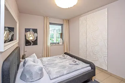 Ein Bett oder Betten in einem Zimmer der Unterkunft Quartier L (Loschwitz)