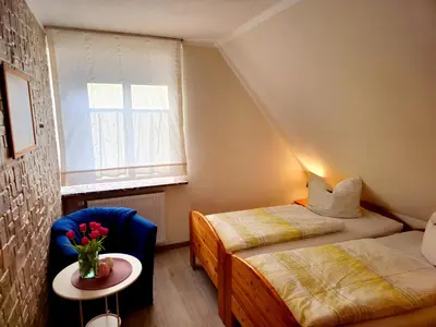 Ein Bett oder Betten in einem Zimmer der Unterkunft Ferienwohnung Geißler