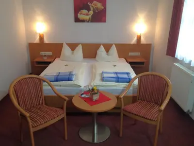 Ein Bett oder Betten in einem Zimmer der Unterkunft Pension Schrägers