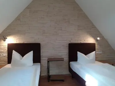 Ein Bett oder Betten in einem Zimmer der Unterkunft Hotel am Schloss