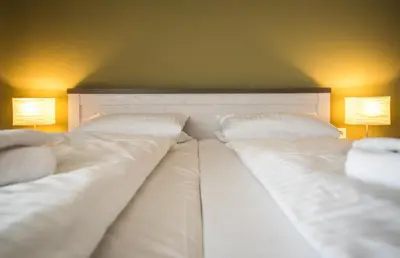 Ein Bett oder Betten in einem Zimmer der Unterkunft Adlerhof