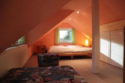 Ein Bett oder Betten in einem Zimmer der Unterkunft Ferienhaus Puttrich