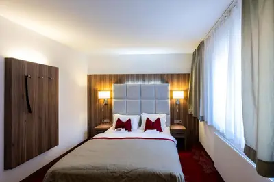 Ein Bett oder Betten in einem Zimmer der Unterkunft Rathener Hof by STEIGER Hotels