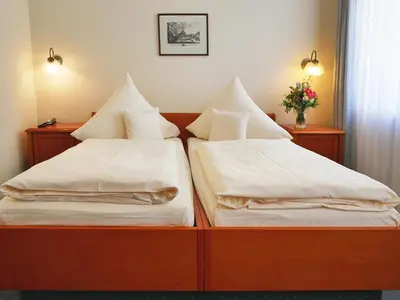 Ein Bett oder Betten in einem Zimmer der Unterkunft Hotel Martha Dresden
