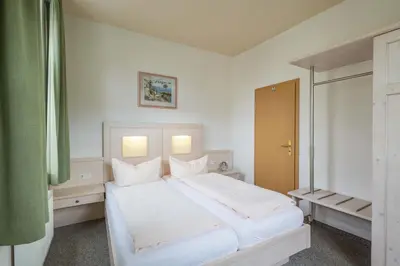 Ein Bett oder Betten in einem Zimmer der Unterkunft Ferienwohnung zur Steinburg