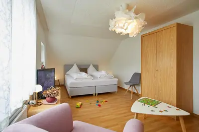 Ein Bett oder Betten in einem Zimmer der Unterkunft Tannmühle Hotel und Restaurant GmbH