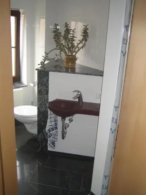 Ein Bett oder Betten in einem Zimmer der Unterkunft Ferienwohnung TOSCANA