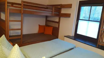 Ein Bett oder Betten in einem Zimmer der Unterkunft Ferienwohnung TOSCANA