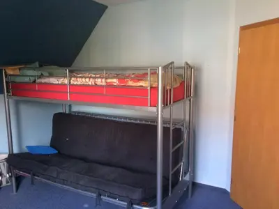 Ein Etagenbett oder Etagenbetten in einem Zimmer der Unterkunft Haus Sonnenstein