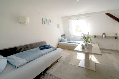 Ein Sitzbereich in der Unterkunft Apartments am Schlosspark