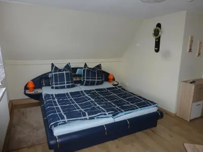 Ein Bett oder Betten in einem Zimmer der Unterkunft Ferienwohnung Großmann