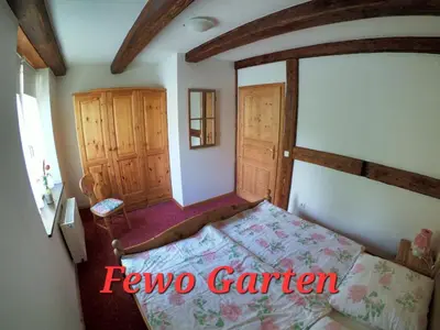 Ein Bett oder Betten in einem Zimmer der Unterkunft Ferienwohnung zur Schmiede