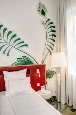 Ein Bett oder Betten in einem Zimmer der Unterkunft HYPERION Hotel Dresden Am Schloss