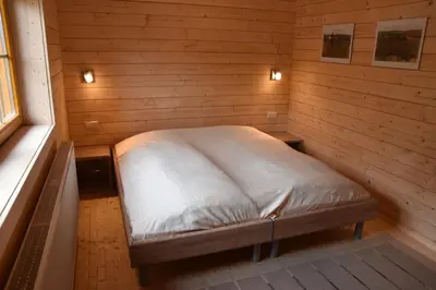 Ein Bett oder Betten in einem Zimmer der Unterkunft Erzgebirgsholzhaus am Lugstein