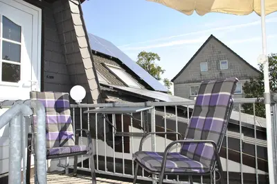 Ein Balkon oder eine Terrasse in der Unterkunft FeWo am Pochwerk-Badeteich