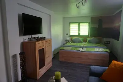 Ein Bett oder Betten in einem Zimmer der Unterkunft FerienhausTeube