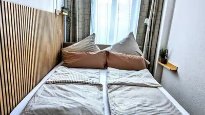 Ein Bett oder Betten in einem Zimmer der Unterkunft Meissen Apartments - moderne Ferienwohnungen in Meißen am Lutherplatz