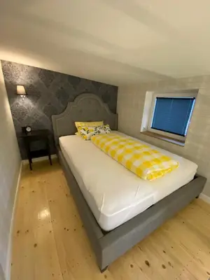 Ein Bett oder Betten in einem Zimmer der Unterkunft Pension Gablenz
