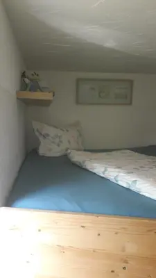 Ein Bett oder Betten in einem Zimmer der Unterkunft Ferienhaus Schrammsteinblick