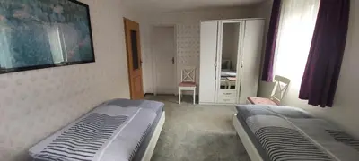 Ein Bett oder Betten in einem Zimmer der Unterkunft Apartments mit 2 Schlafzimmern