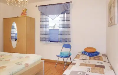 Ein Bett oder Betten in einem Zimmer der Unterkunft Cozy Apartment In Gelenau With Wifi