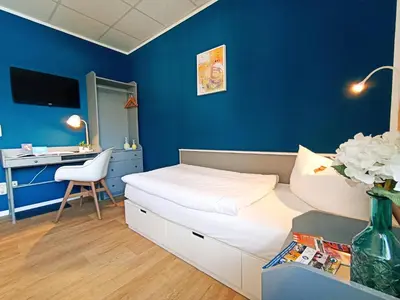Ein Bett oder Betten in einem Zimmer der Unterkunft City Hotel