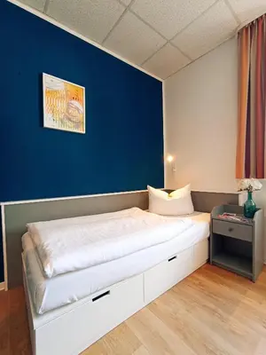 Ein Bett oder Betten in einem Zimmer der Unterkunft City Hotel