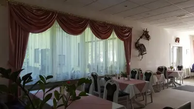 Ein Restaurant oder anderes Speiselokal in der Unterkunft Pension Waldfrieden
