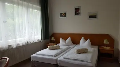 Ein Bett oder Betten in einem Zimmer der Unterkunft Pension Waldfrieden