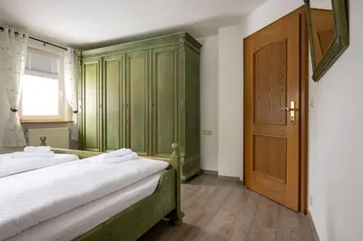 Ein Bett oder Betten in einem Zimmer der Unterkunft Ferienanlage Zum Silberstollen 2 Häuser am Berg Polderhof und Weißeritzhütte