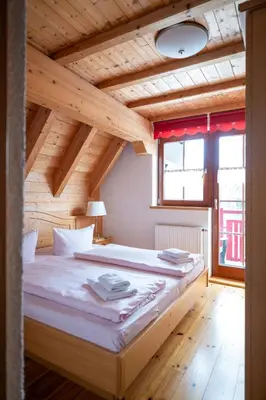Ein Bett oder Betten in einem Zimmer der Unterkunft Ferienanlage Zum Silberstollen 2 Häuser am Berg Polderhof und Weißeritzhütte