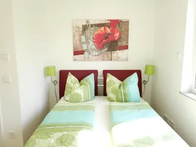 Ein Bett oder Betten in einem Zimmer der Unterkunft Ferienwohnung Seenland