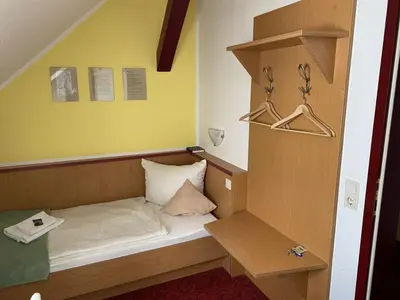Ein Bett oder Betten in einem Zimmer der Unterkunft Panoramahotel Lilienstein