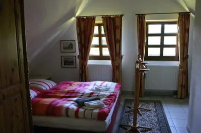 Ein Bett oder Betten in einem Zimmer der Unterkunft Ferienwohnung Erzgebirge
