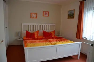 Ein Bett oder Betten in einem Zimmer der Unterkunft Ferienwohnung Richter