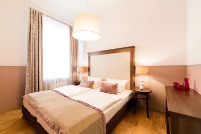 Ein Bett oder Betten in einem Zimmer der Unterkunft Aparthotel Am Schloss