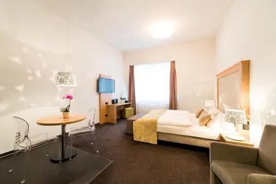Ein Bett oder Betten in einem Zimmer der Unterkunft Aparthotel Am Schloss