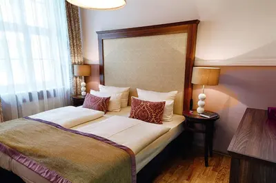 Ein Bett oder Betten in einem Zimmer der Unterkunft Aparthotel Am Schloss