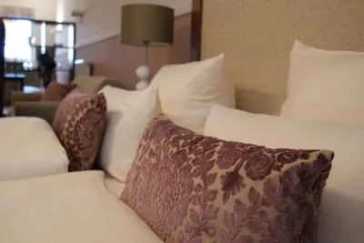 Ein Bett oder Betten in einem Zimmer der Unterkunft Aparthotel Am Schloss