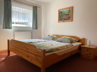 Ein Bett oder Betten in einem Zimmer der Unterkunft Ferienwohnung Grieser