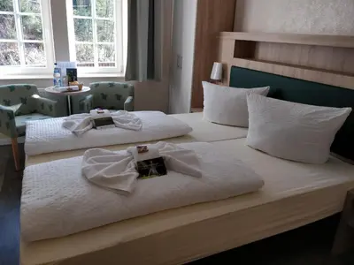 Ein Bett oder Betten in einem Zimmer der Unterkunft Lichtenhainer Wasserfall