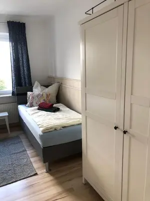 Ein Bett oder Betten in einem Zimmer der Unterkunft Ferienwohnung Dresden West