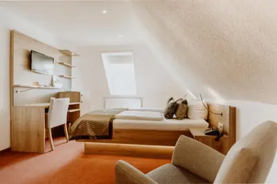Ein Bett oder Betten in einem Zimmer der Unterkunft Hotel Frauensteiner Hof