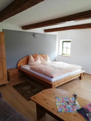 Ein Bett oder Betten in einem Zimmer der Unterkunft Lichtenhainer Hof