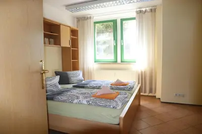 Ein Bett oder Betten in einem Zimmer der Unterkunft Ferienwohnungen am Großen Garten