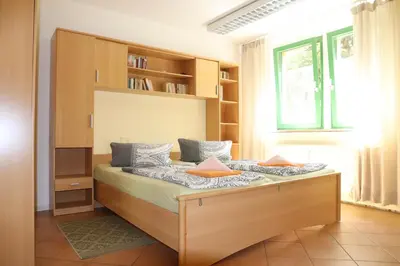 Ein Bett oder Betten in einem Zimmer der Unterkunft Ferienwohnungen am Großen Garten