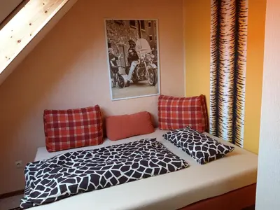 Ein Bett oder Betten in einem Zimmer der Unterkunft Wildholz Sachsen
