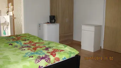 Ein Bett oder Betten in einem Zimmer der Unterkunft Ferienzimmer Haus Läsker