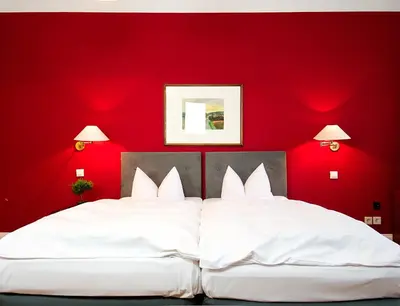 Ein Bett oder Betten in einem Zimmer der Unterkunft Hotel Albrechtshof Gohrisch