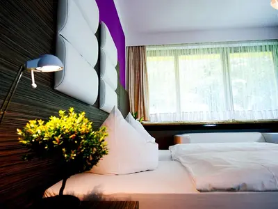 Ein Bett oder Betten in einem Zimmer der Unterkunft Hotel Albrechtshof Gohrisch